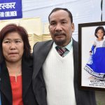 Tarh Peeju’s parents hold a picture of their daughter who won an award (Posthumously) for saving two children from drowning in a river, losing her life because of strong undercurrents