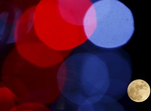 The full moon is pictured trough Christmas lights decoration in Skopje, Macedonia, on December 25, 2015