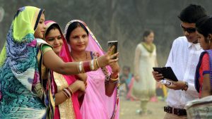 Women take a selfie at Maidan in Kolkata