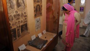 A visitor looks at the artifacts kept at the ancestral house of Shaheed-A-Azam, Bhagat Singh