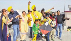 A woman from Philippines enjoys kite with her in laws on Basant Panchami in Bathinda