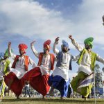 Artists performing traditional dance, Bhangra, on the inaugural day of Kila Raipur Rural Sports Festival at village Kila Raipur in Ludhiana