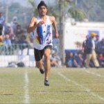 Athletes take part in the 100m race during the festival
