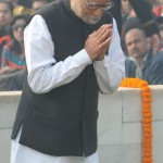 Former Prime Minister Manmohan Singh pays his respects to Mahatma Gandhi on his death anniversary at Rajghat in New Delhi on January 30, 2016. The day is observed as observed as Martyrs' Day in the country