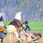 Nihangs try to control their horses on the second day of the 80th Kila Raipur Sports Festival Ludhiana