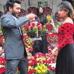 Youngsters select flowers at a shop on the eve of Valentine's Day in Chandigarh