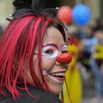 A clown performs during the inaugural parade of the 15th Ibero American Theater Festival in Bogota Colombia on March 12, 2016