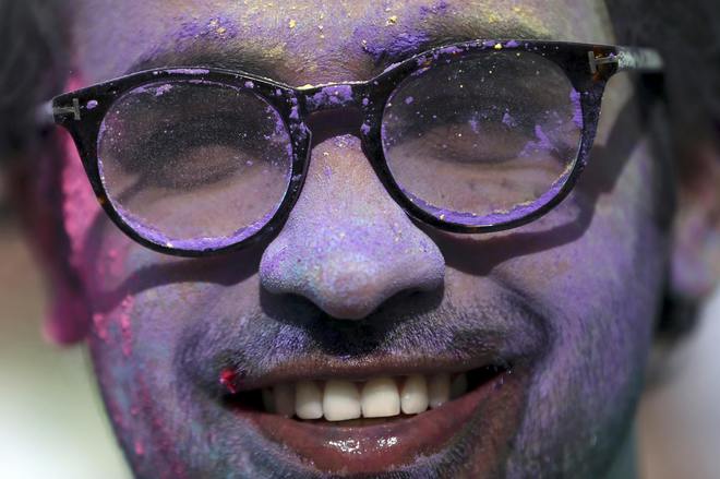 A reveller takes part in the Holi Festival of Colours in London, Britain, on August 13, 2016.