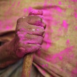 A widow holds a stick during Holi celebrations at a temple in Vrindavan, Uttar Pradesh