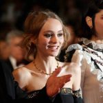 Actresses Lily-Rose Depp, centre, and Soko, right, pose for photographers upon arrival at the screening of the film I, Daniel Blake at the 69th international film festival, Cannes, southern France, on May 13, 2016