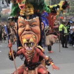 An actor performs during the inaugural parade of the 15th Ibero American Theater Festival in Bogota on March 12, 2016