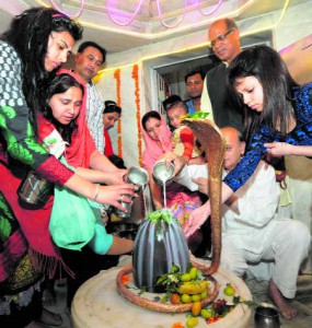 Devotees perform a ritual at a temple in Sector 23 Chandigarh, on the ocassion of Maha Shivaratri