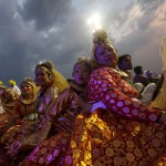 Participants watch others performing dance during the World Culture Festival on the banks of the river Yamuna in New Delhi on March 12, 2016