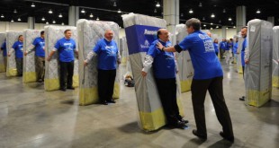 Largest human mattress dominoes: Aaron's breaks record