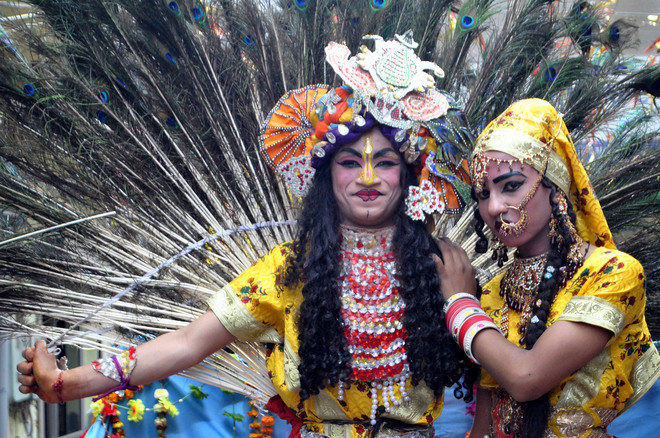 Artistes dress up as Hindu gods Krishna and Radha at a procession to mark Ram Navami in Amritsar on April 4, 2017