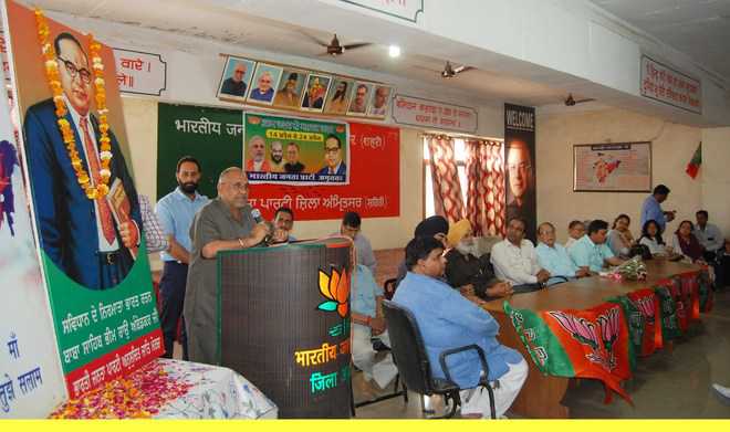 BJP leader Avinsh Rai Khanna addresses party workers at the district BJP office in Amritsar