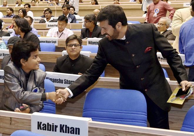 Best Child artist Gaurav Menon shakes hands with Director Kabir Khan at the 63rd National Film Awards 2015 function in New Delhi