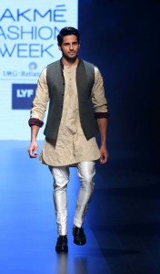 Bollywood actor Sidharth Malhotra showcases a creation by designer Kunal Rawal on the fourth day of the Lakme Fashion Week (LFW) summer/resort 2016 in Mumbai on April 2, 2016