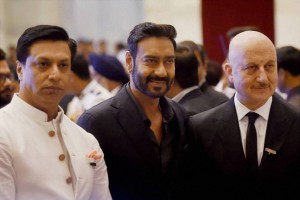 Bollywood actors Anupam Kher, Ajay Devgn and filmmaker Madhur Bhandarkar during an investiture ceremony at Rashtrapati Bhawan in New Delhi on March 28, 2016