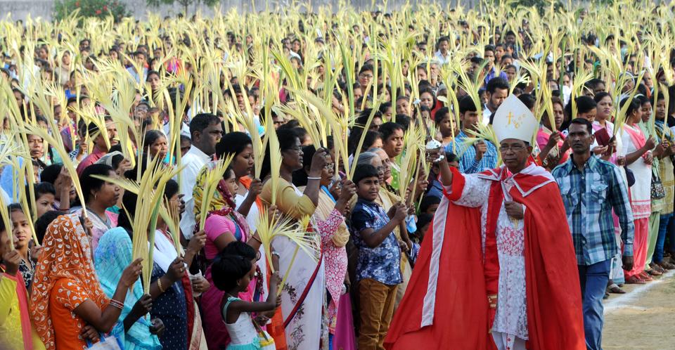 Catholics attends the special mass on 'Palm Sunday' at St John's school ground in Ranchi, India