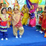 Children of DPS junior wing perform gidha to celebrate the harvest festival