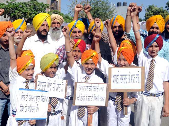 Children take part in a march on the occasion of Baisakhi in Amritsar