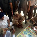 Deputy Chief Minister Sukhbir Singh Badal pays cards with the elderly at Badal Village in Muktsar