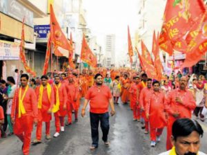 Devotees carry flags at the shobha yatra of Panch Mukhi Shree Balaji in Bathinda