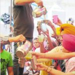 Devotees have sweetened water on the occasion of Baisakhi at Gurdwara Gau Ghat, Ludhiana