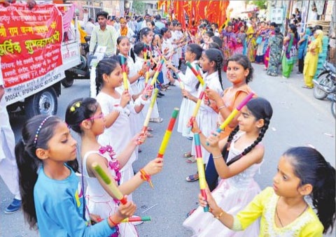 Devotees take out a religious procession to mark Ram Navmi children participate in dandia in Bathinda
