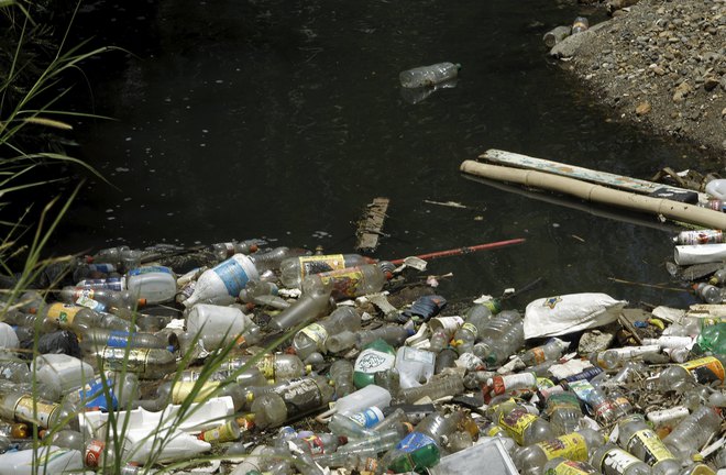 Garbage floats on the La Cangreja river in San Jose, Costa Rica, ahead of World Earth Day on April 21, 2016