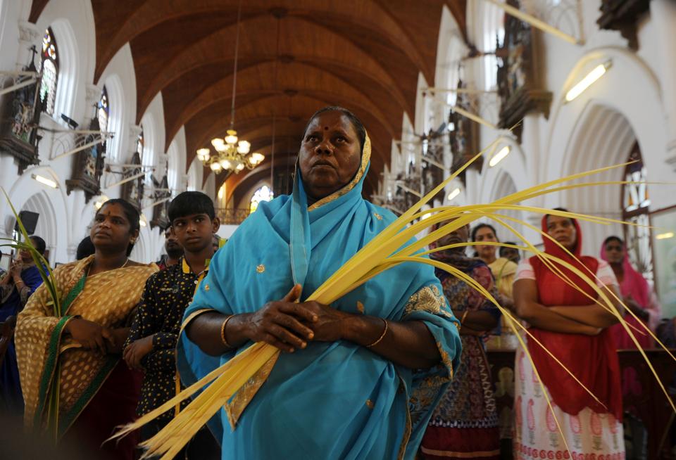 Indian Christian worshippers take part in a Palm Sunday Mass in Chennai on April 9, 2017. Palm Sunday marks the sixth and last Sunday of Lent and the beginning of Holy Week