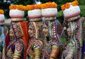 Indian folk dancers from the Panghat Group of Performing Arts pose for a photograph during a dress rehearsal for an event to mark the forthcoming Hindu festival Navaratri, or the Festival of Nine Nights, in Ahmedabad on September 25, 2016. The Navaratri festival begins on October 1.