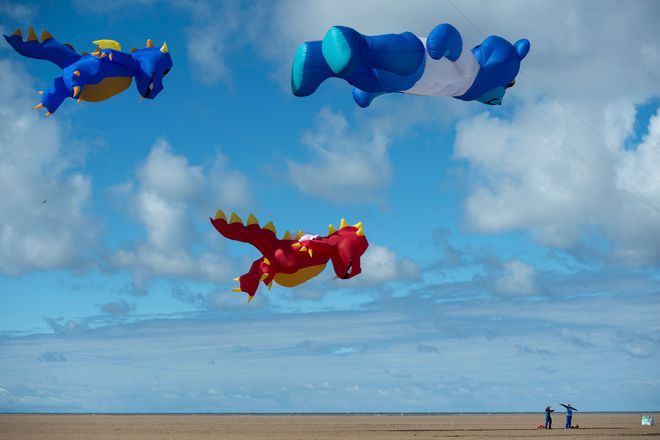 Kite enthusiasts participate in the St Annes Kite Festival on the seafront in Lytham St Annes, northwest England on July 30, 2016.