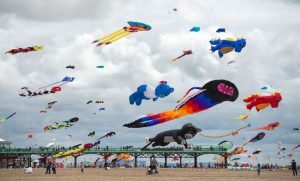 Kite enthusiasts participate in the St Annes Kite Festival on the seafront in Lytham St Annes, northwest England on July 30, 2016.