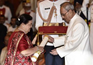Kokilaben Ambani (left), wife of the late industrialist Dhirubhai Ambani, receives on his behalf Padma Vibhushan Award from President Pranab Mukherjee during an investiture ceremony at Rashtrapati Bhawan in New Delhi on March 28, 2016
