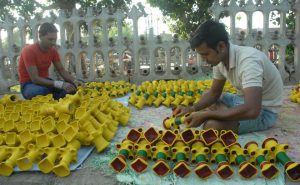 Members of a potter family make earthen lamps for Diwali near Gate Hakima in Amritsar