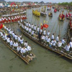 Participants hold bamboo sticks as they push to rowboats during a traditional celebration for Qingming Festival, also known as Tomb Sweeping Festival, in Taizhou, Jiangsu Province, China, on April 4, 2016
