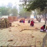 Students at a demolished school in Surghuri village of Faridkot