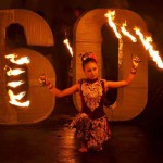 This picture taken in Malang on March 19, 2016 shows an Indonesian dancers performin a traditional dance with fire while people celebrate Earth Hour. Millions of people were expected to switch off their lights for Earth Hour on March 19 in a global effort to raise awareness about climate change that was even to be monitored from space.