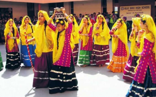 Girls present a cultural dance to celebrate Baisakhi at blue bird high school in Panchkula