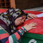 A mother mourns on the coffin on May 6, 2016 in Kilis, during the funeral ceremony of her 5 years old daughter Nisa Done Sezer who was killed the day before after a rocket hit the house. One person was killed and seven more wounded when rockets fired from Syria slammed into the Turkish border region of Kilis, which has been regularly targeted by jihadists this year, the Dogan news agency said.