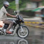 A motorcyclist rides during pre-monsoon rain in Karnal on June 15, 2015. Pre-monsoon showers lashed several parts of the region.