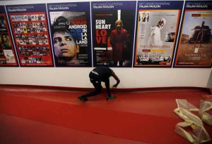 A worker installs red carpet inside the Festival Palace as preparations continue ahead of the sart of the 69th Cannes Film Festival in Cannes, France, on May 10, 2016