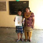 Araman Seth receiving First Prize from Mrs. Sunita Nijhawan for 10-12 year age group poster making competition