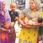 Poor Women with their children the Indira Colony slum in Jalandhar