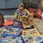 Prem Rani, 60, has been hawking embroidered cushion covers at the bustling Janpath market for the past thirty years. A mother of two, both of whom are now married and have children of their own.