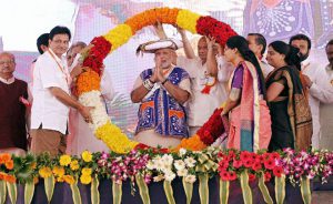Prime Minister Narendra Modi being garlanded at a function to mark his 67th birthday in Dahod near Ahmedabad on September 17, 2016.