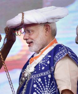 Prime Minister Narendra Modi being welcomed on stage at a function in Gujarat’s Limkheda village on September 17, 2016. Modi is in his home state to mark his birthday.