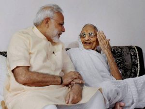 Prime Minister Narendra Modi speaks to his mother on his 67th birthday in Gandhinagar on September 17, 2016. The Prime Minister is in the state to visit his mother on his birthday.